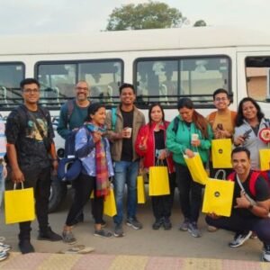 Travel group beside a passenger minibus